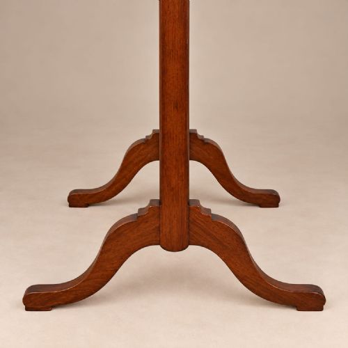 fig 1. A full-length 1920s burr walnut cheval mirror featuring a shaped arched top frame, twin side uprights topped with turned finials, and splayed legs.