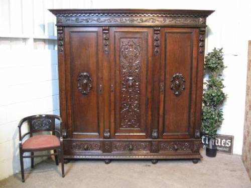 fig 1. STUNNING ANTIQUE LATE VICTORIAN GOTHIC CARVED OAK BEDROOM SUITE,TRIPLE WARDROBE,KING SIZE BEDSTEAD,PAIR BEDSIDE CABINETS,CHEST OF DRAWERS,PAIR BEDROOM CHAIRS C1890
