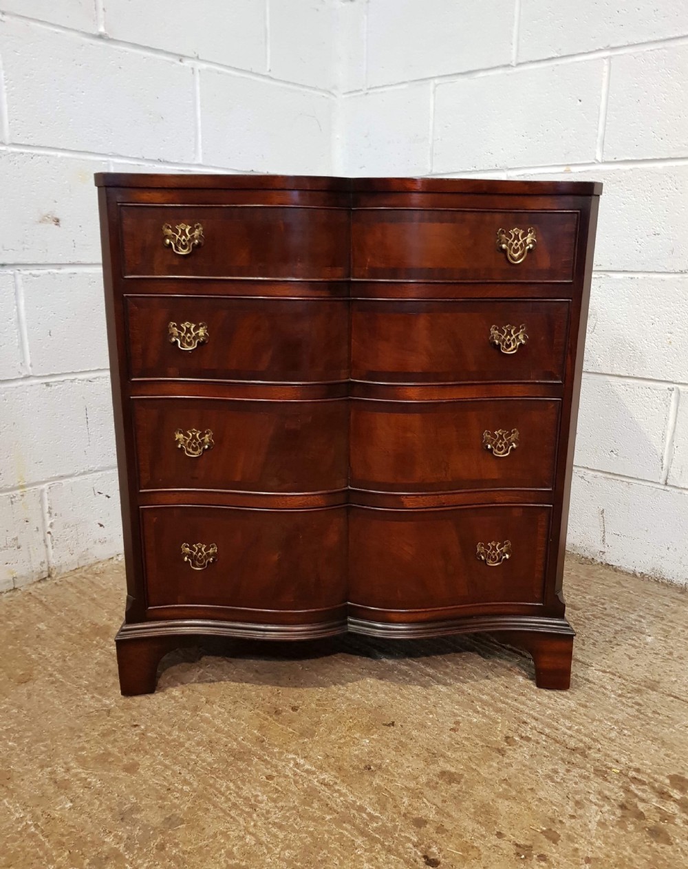 ANTIQUE FLAMED MAHOGANY SERPENTINE CHEST OF DRAWERS C1920