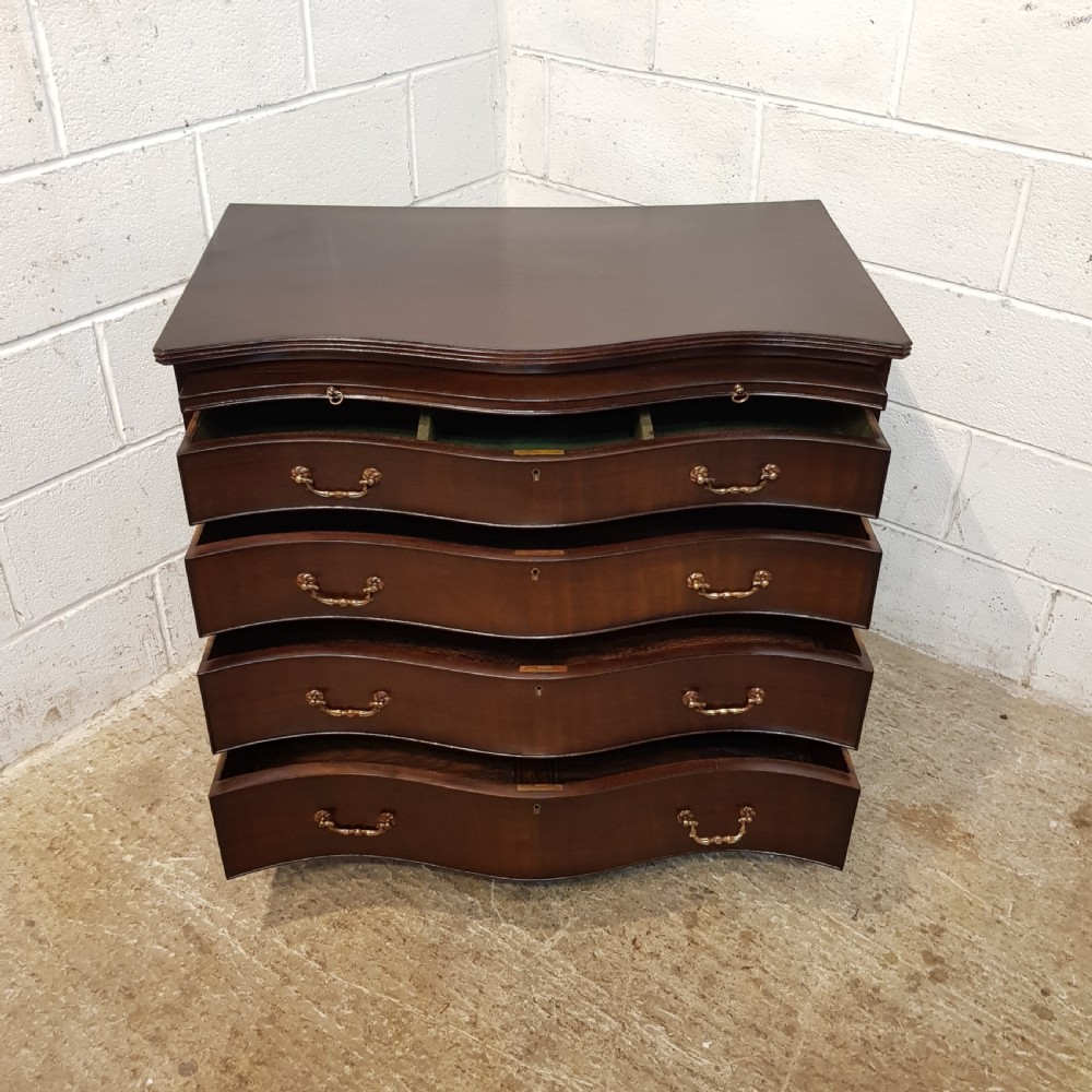 ANTIQUE MAHOGANY SERPENTINE SHAPED CHEST OF DRAWERS WITH BRUSHING SLIDE C1920 View III