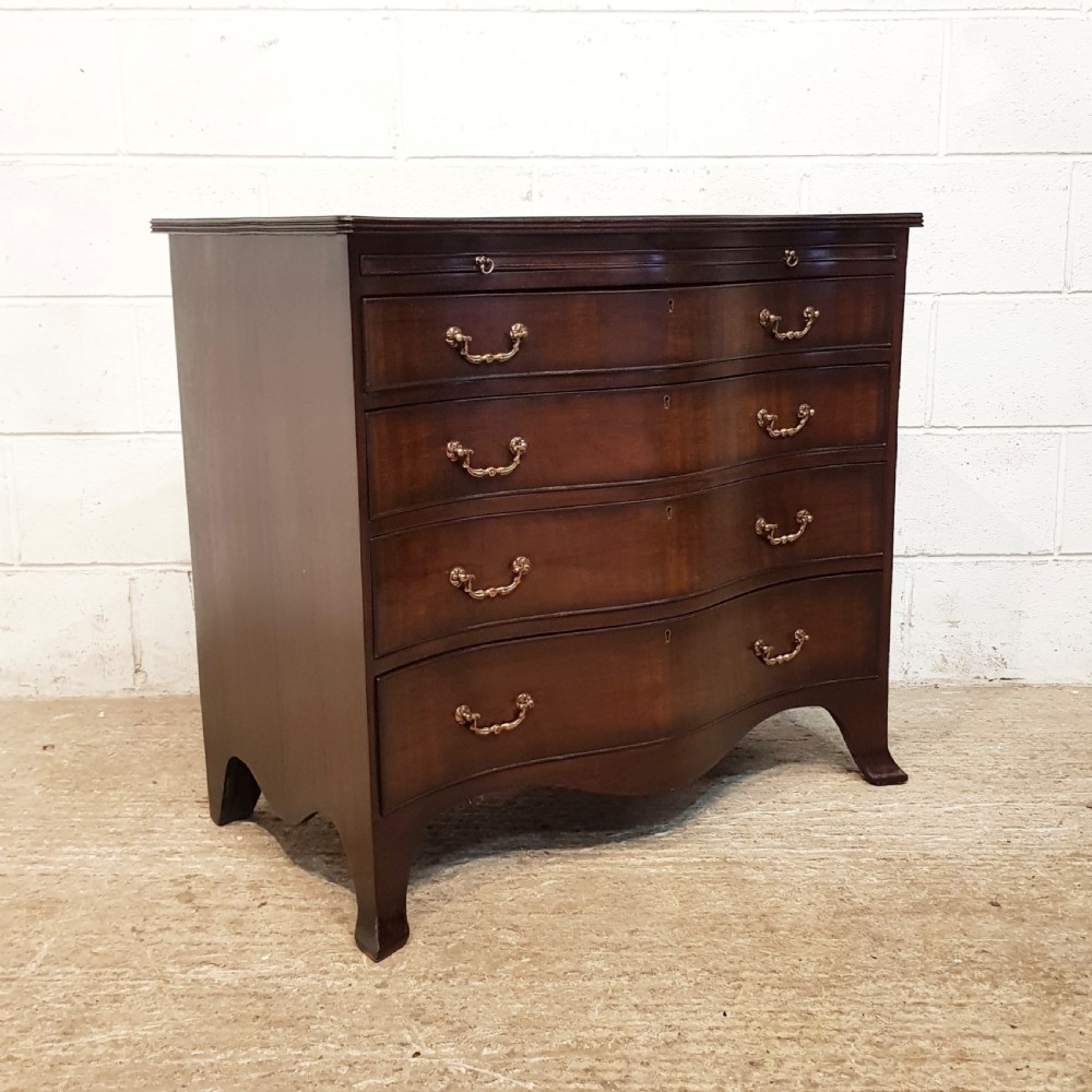 ANTIQUE MAHOGANY SERPENTINE SHAPED CHEST OF DRAWERS WITH BRUSHING SLIDE C1920 View IV