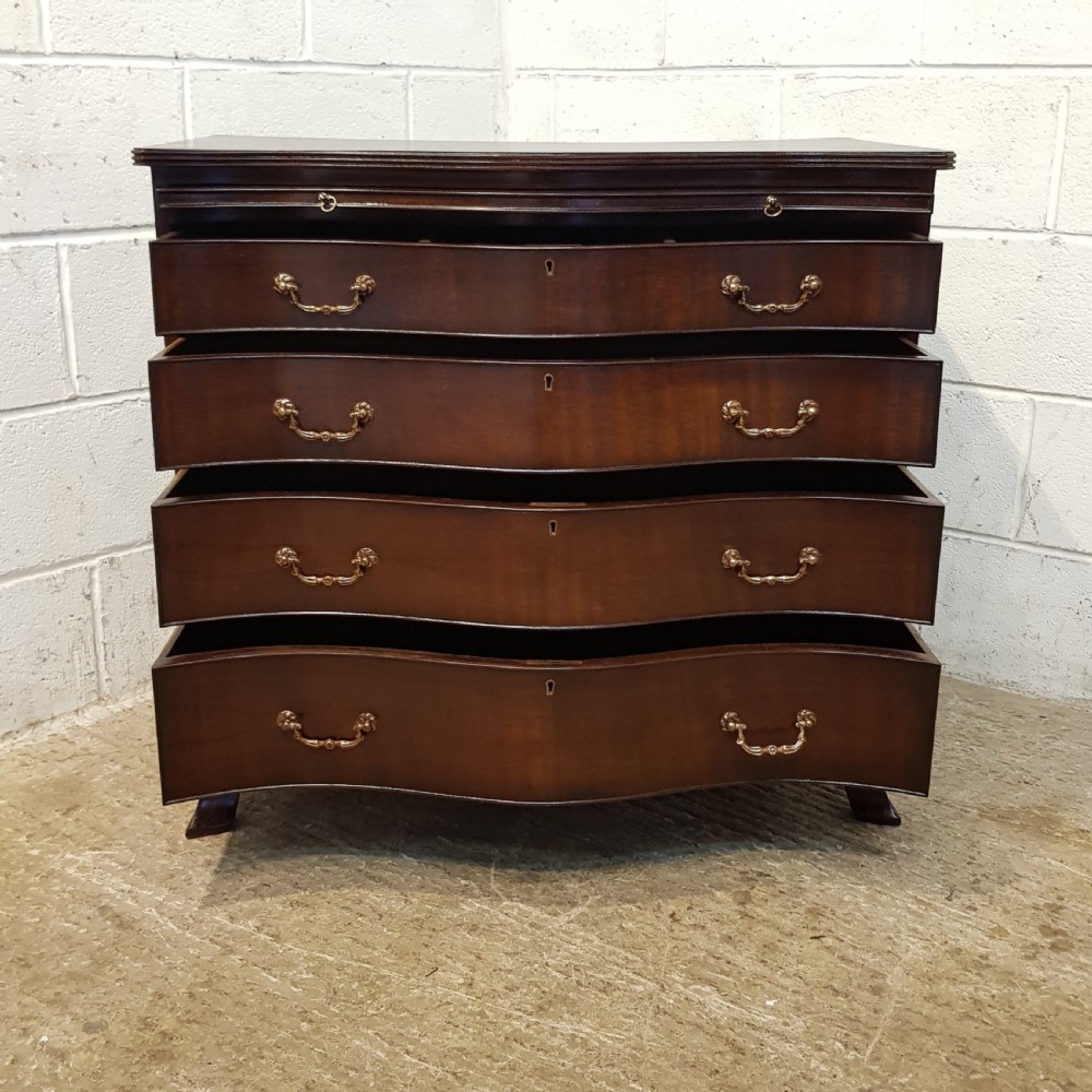 ANTIQUE MAHOGANY SERPENTINE SHAPED CHEST OF DRAWERS WITH BRUSHING SLIDE C1920 View V