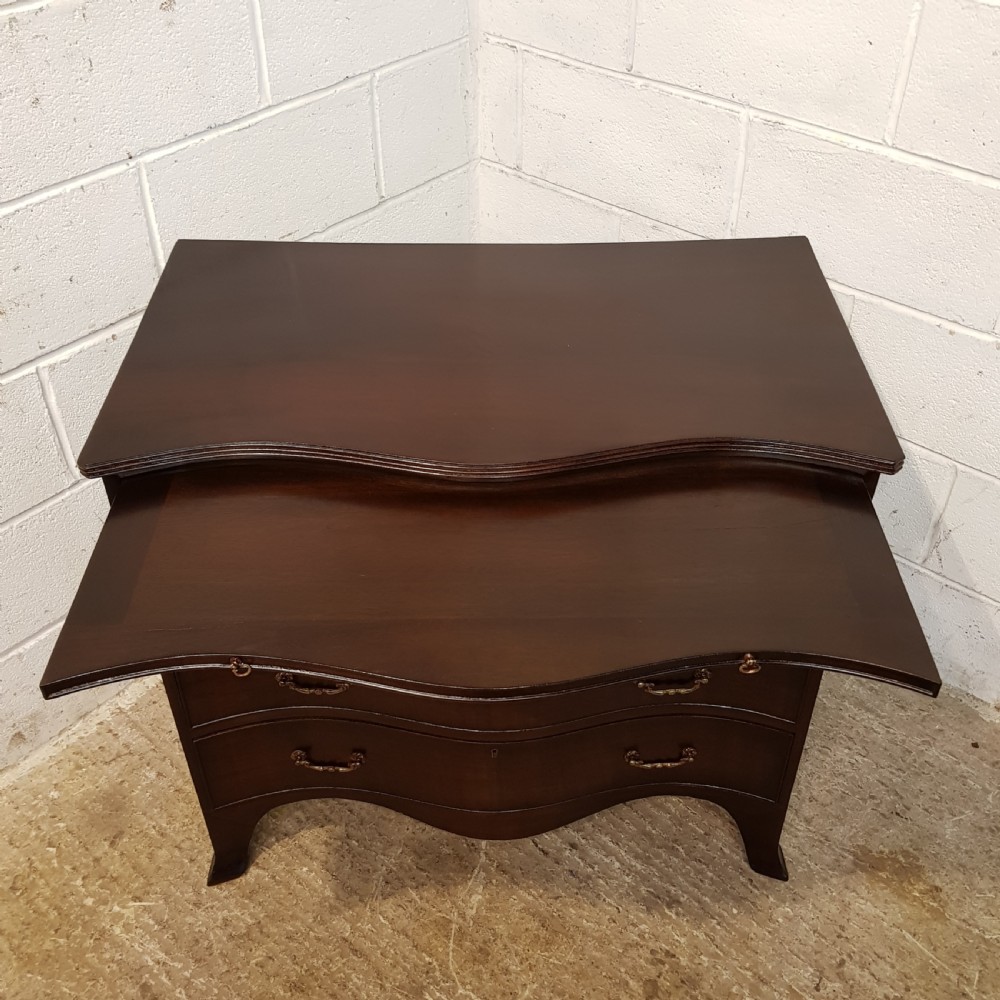 ANTIQUE MAHOGANY SERPENTINE SHAPED CHEST OF DRAWERS WITH BRUSHING SLIDE C1920 View VI