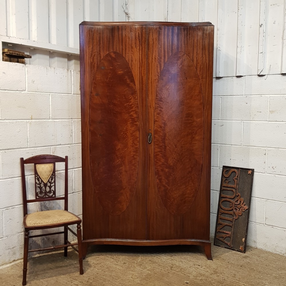ANTIQUE MAHOGANY SERPENTINE FRONT MAHOGANY DOUBLE WARDROBE C1920
