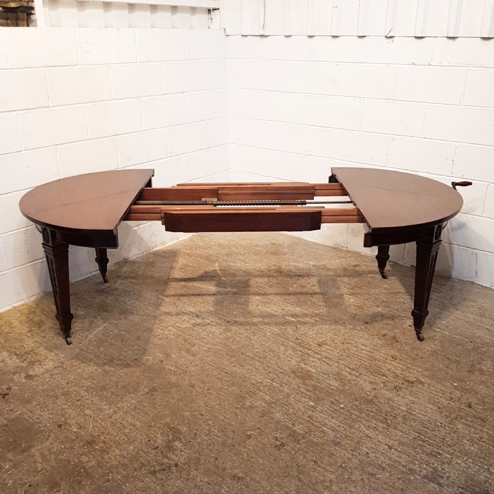 ANTIQUE EDWARDIAN MAHOGANY EXTENDING DINING TABLE BY MAPLE AND CO- C1900 View III