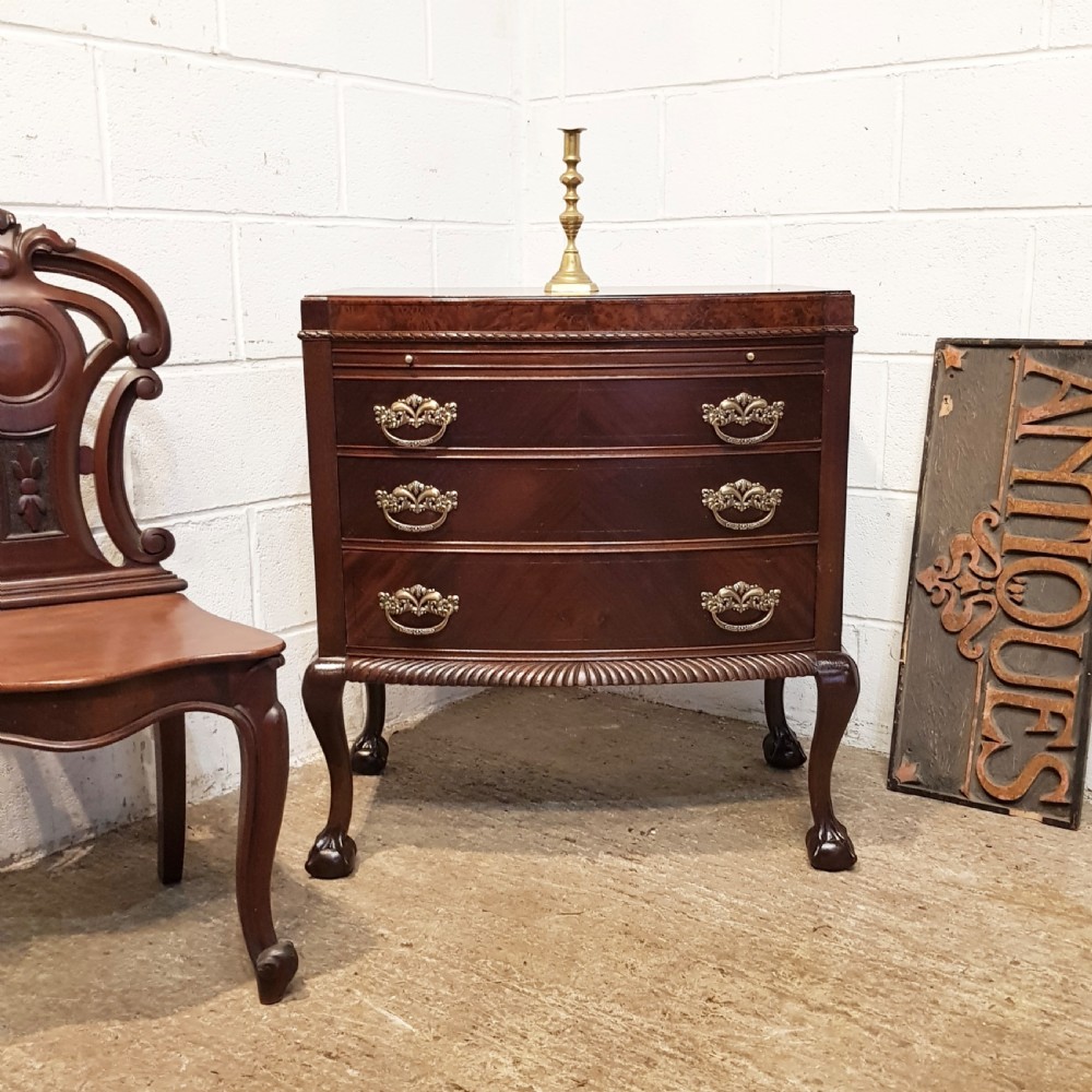 ANTIQUE MAHOGANY BOW FRONT CHEET OF DRAWERS WITH WRITING SLIDE C1920