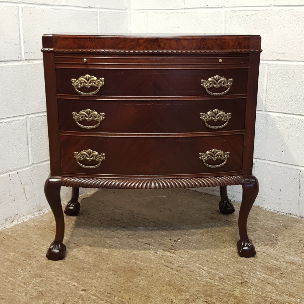 ANTIQUE MAHOGANY BOW FRONT CHEET OF DRAWERS WITH WRITING SLIDE C1920 View V