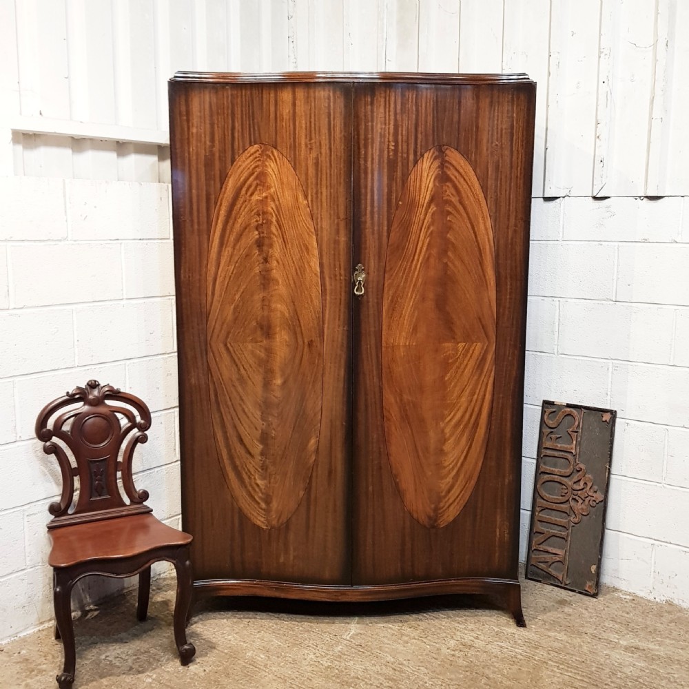 ANTIQUE MAHOGANY SERPENTINE SHAPED DOUBLE WARDROBE C1920
