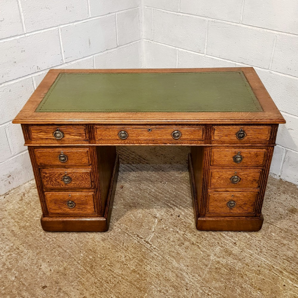 AN ANTIQUE EDWARDIAN OAK TWIN PEDESTAL DESK  View VI