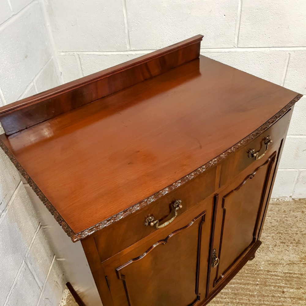 AN ANTIQUE EDWARDIAN MAHOGANY BOW FRONTED CABINET View II
