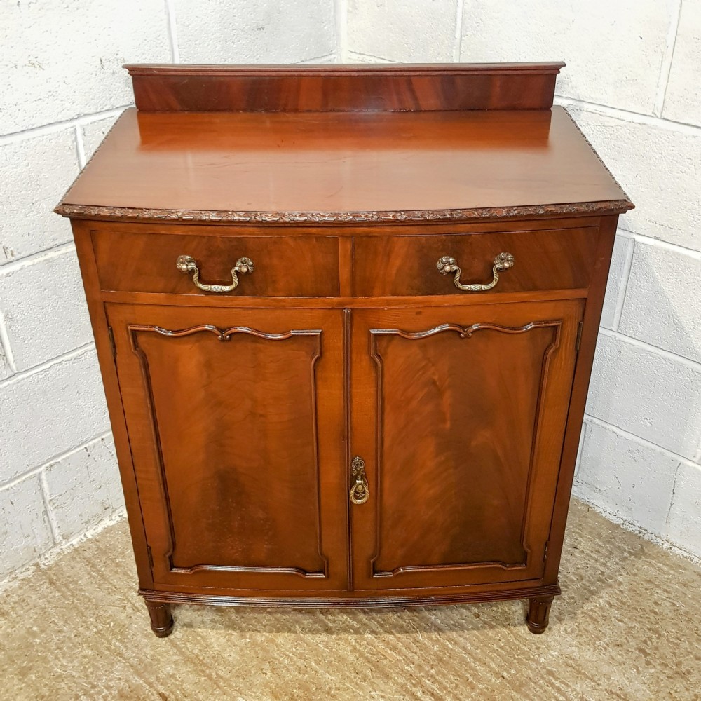 AN ANTIQUE EDWARDIAN MAHOGANY BOW FRONTED CABINET View III