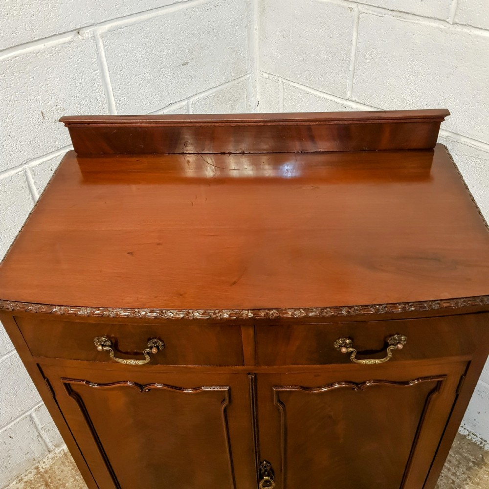 AN ANTIQUE EDWARDIAN MAHOGANY BOW FRONTED CABINET View VIII
