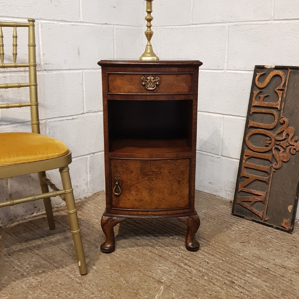 AN ANTIQUE BURR WALNUT BOW FRONTED BEDSIDE CABINET C1920