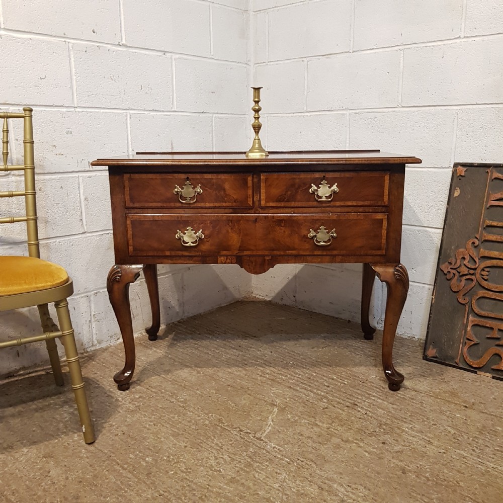 AN ANTIQUE BURR WALNUT LOWBOY BY WARING S GILLOWS STAMPED C1920