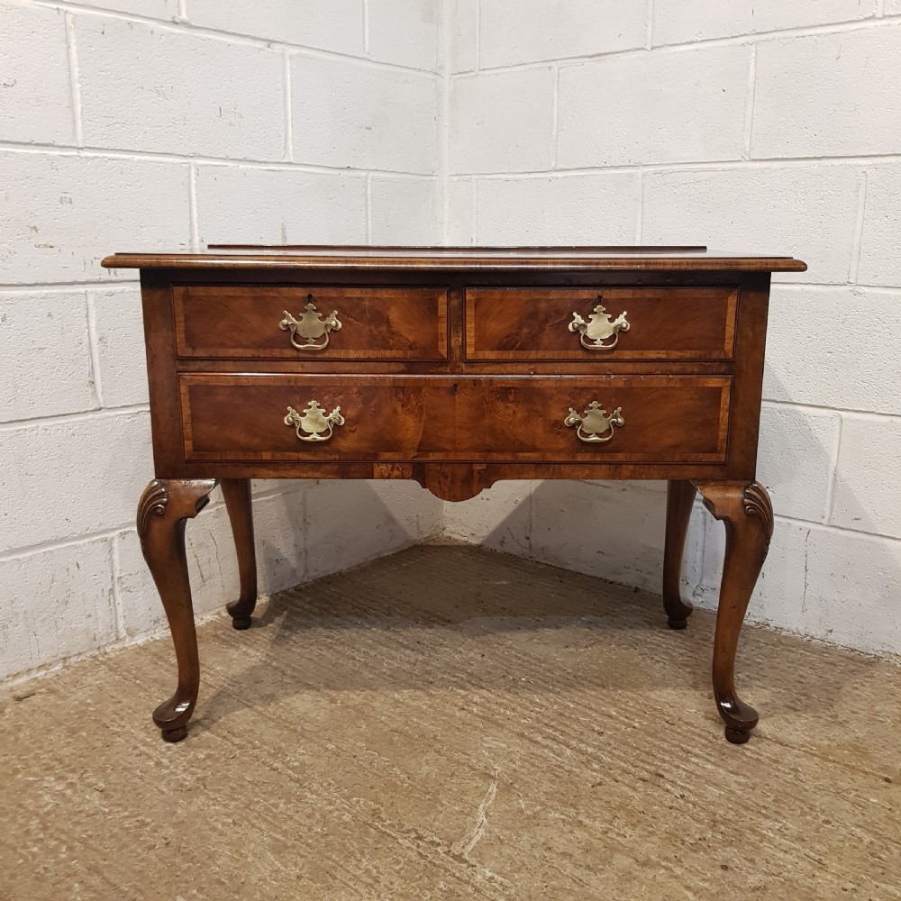 AN ANTIQUE BURR WALNUT LOWBOY BY WARING S GILLOWS STAMPED C1920 View II