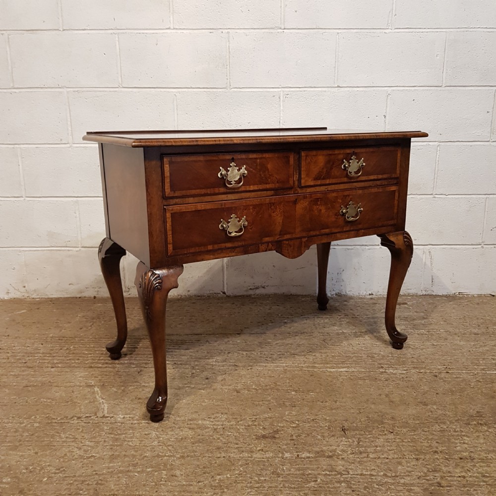AN ANTIQUE BURR WALNUT LOWBOY BY WARING S GILLOWS STAMPED C1920 View V