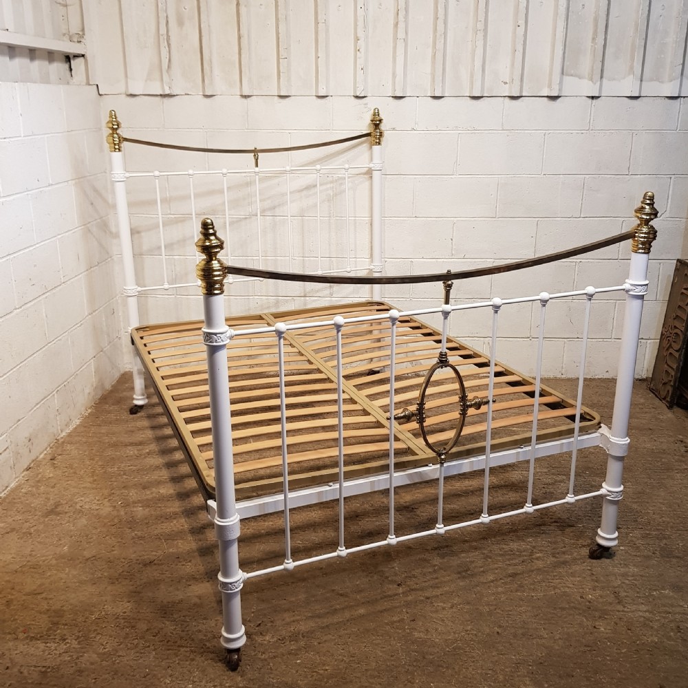 AN ANTIQUE VICTORIAN BRASS AND IRON DOUBLE BEDSTEAD C1880