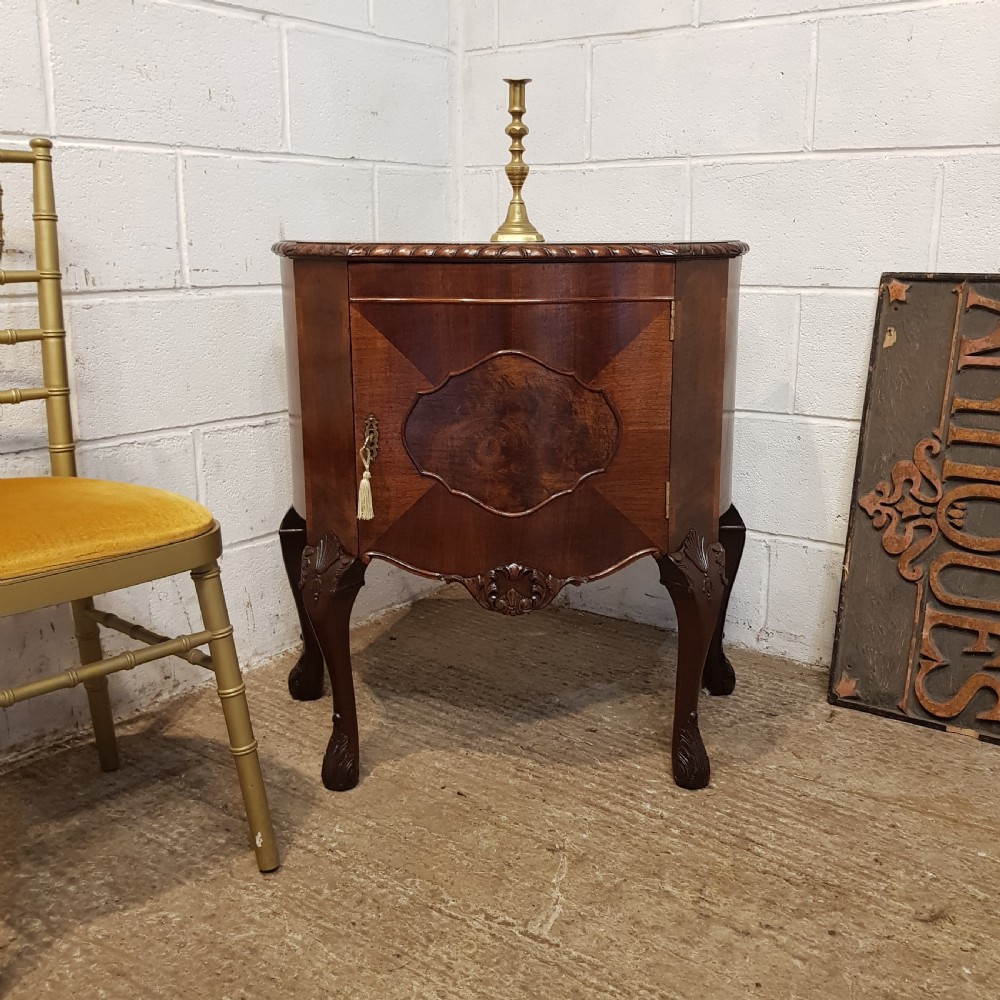 AN ANTIQUE WALNUT SERPENTINE SHAPED SMALL CABINET BY MAPLE & CO C1920