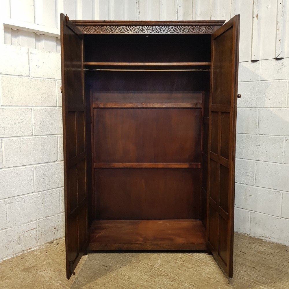 AN ANTIQUE OAK CARVED DOUBLE WARDROBE C1920 View II