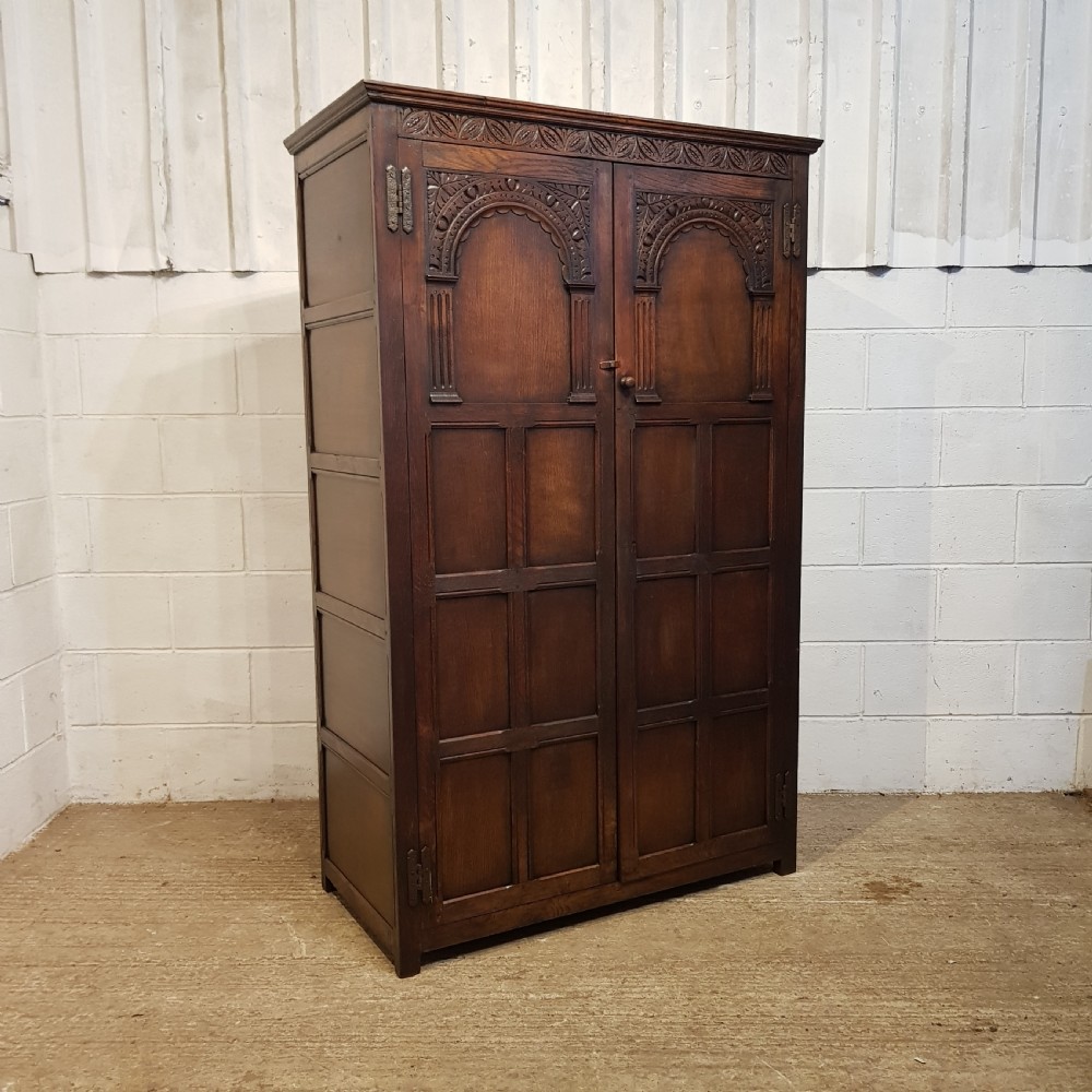 AN ANTIQUE OAK CARVED DOUBLE WARDROBE C1920 View V