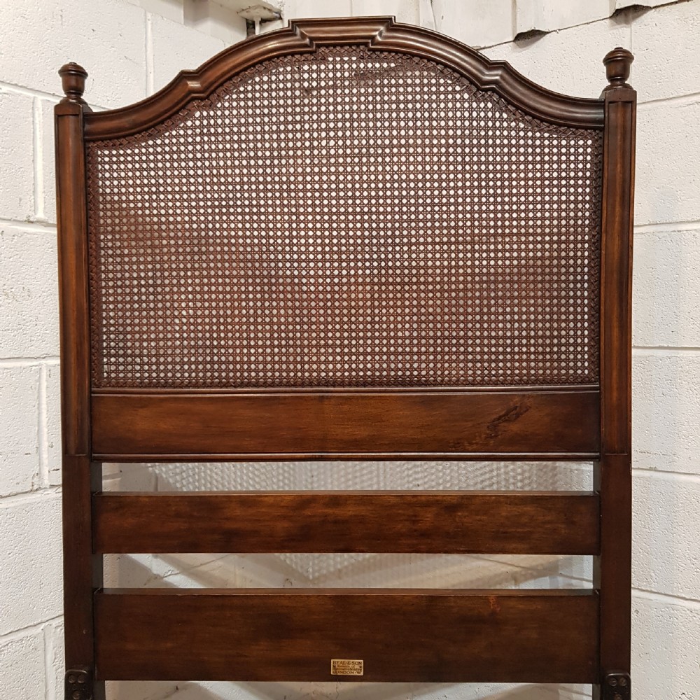 BY HEALS OF LONDON AN ANTIQUE PAIR OF WALNUT FRAMED SINGLE BEDS WITH BERGERE PANELS C1900 View II