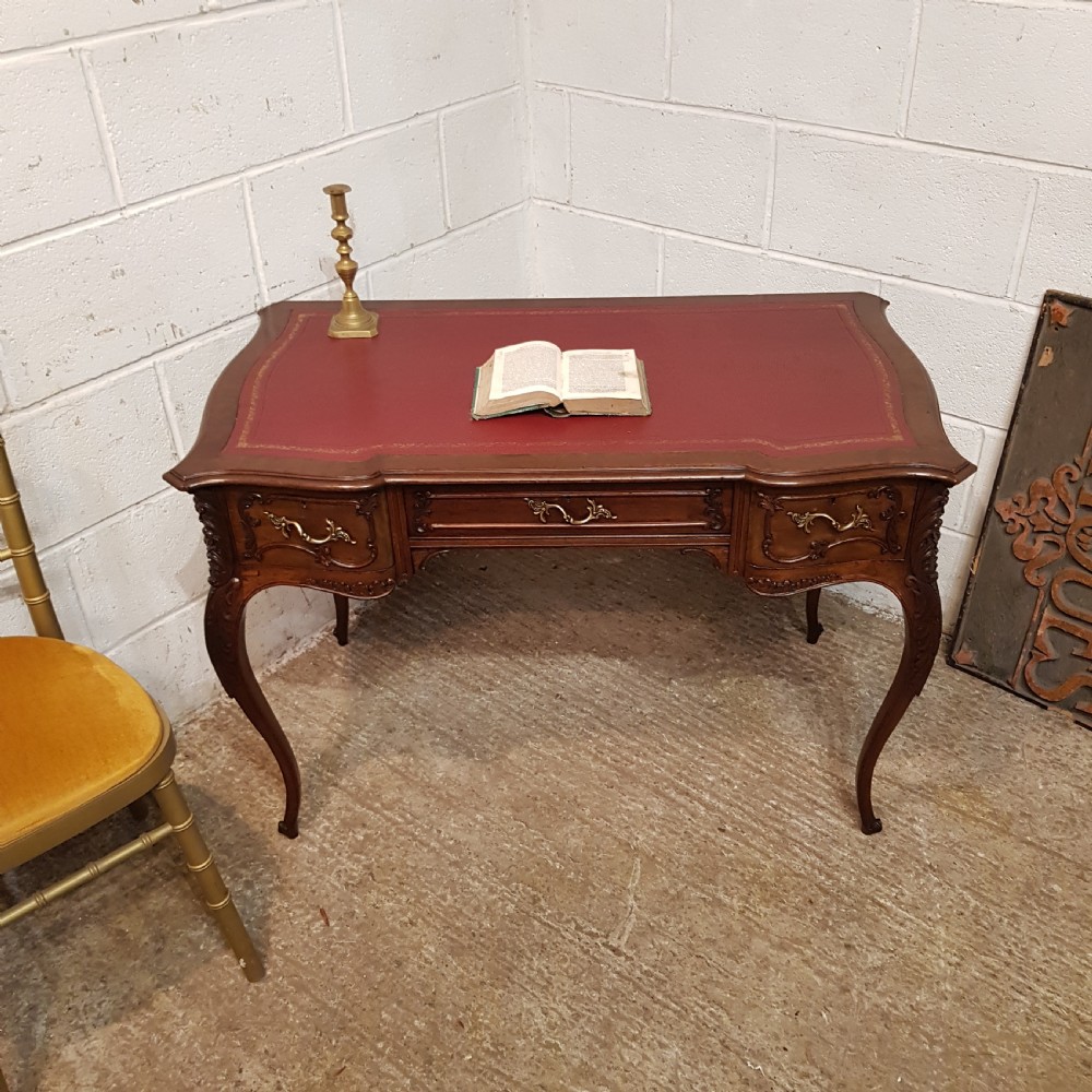 AN ANTIQUE FRENCH MAHOGANY SERPENTINE FRONTED DESK C1880
