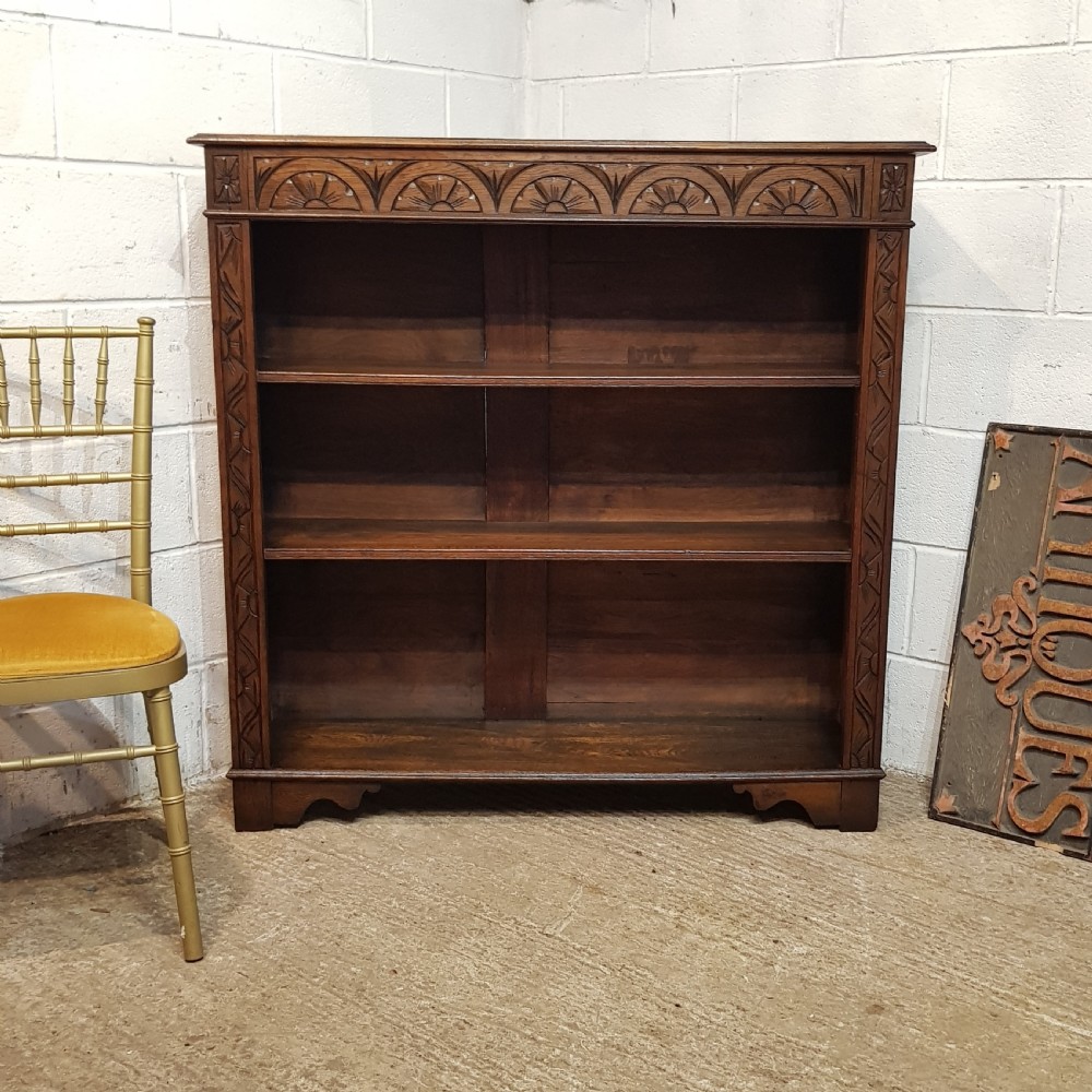 AN ANTIQUE LATE VICTORIAN CARVED OAK OPEN BOOKCASE C1900