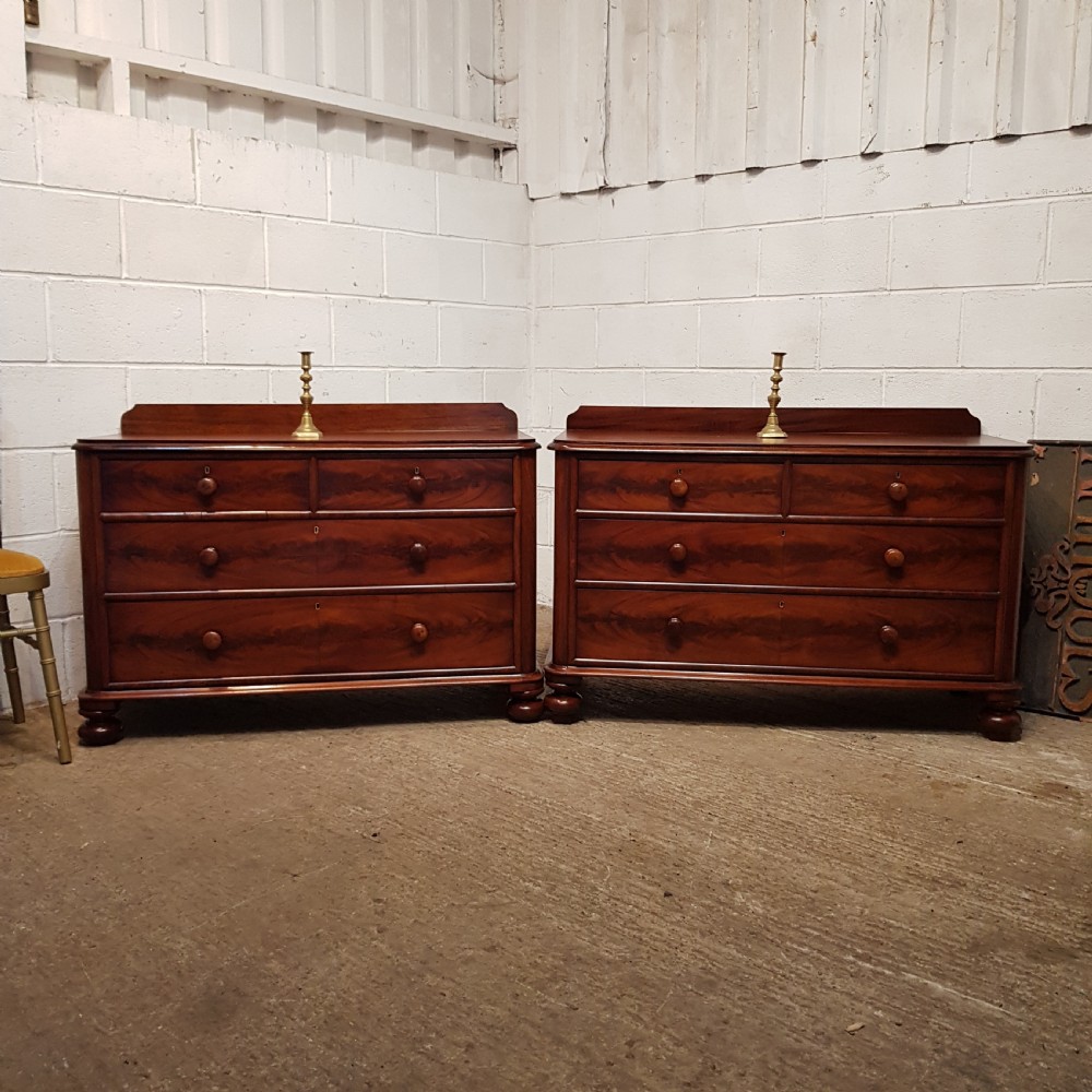 A PAIR OF VICTORIAN MAHOGANY THREE HEIGHT CHEST OF DRAWERS C1880