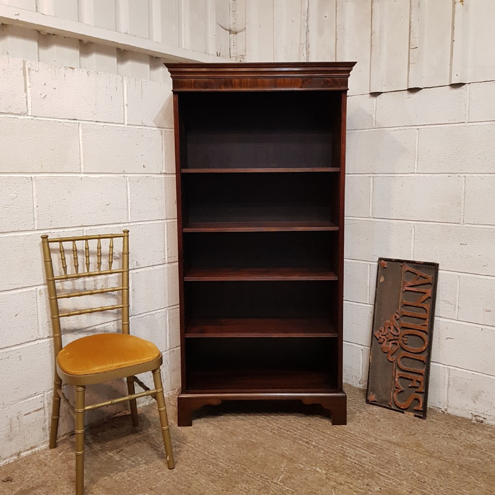 AN ANTIQUE TALL NARROW MAHOGANY OPEN BOOKCASE C1900