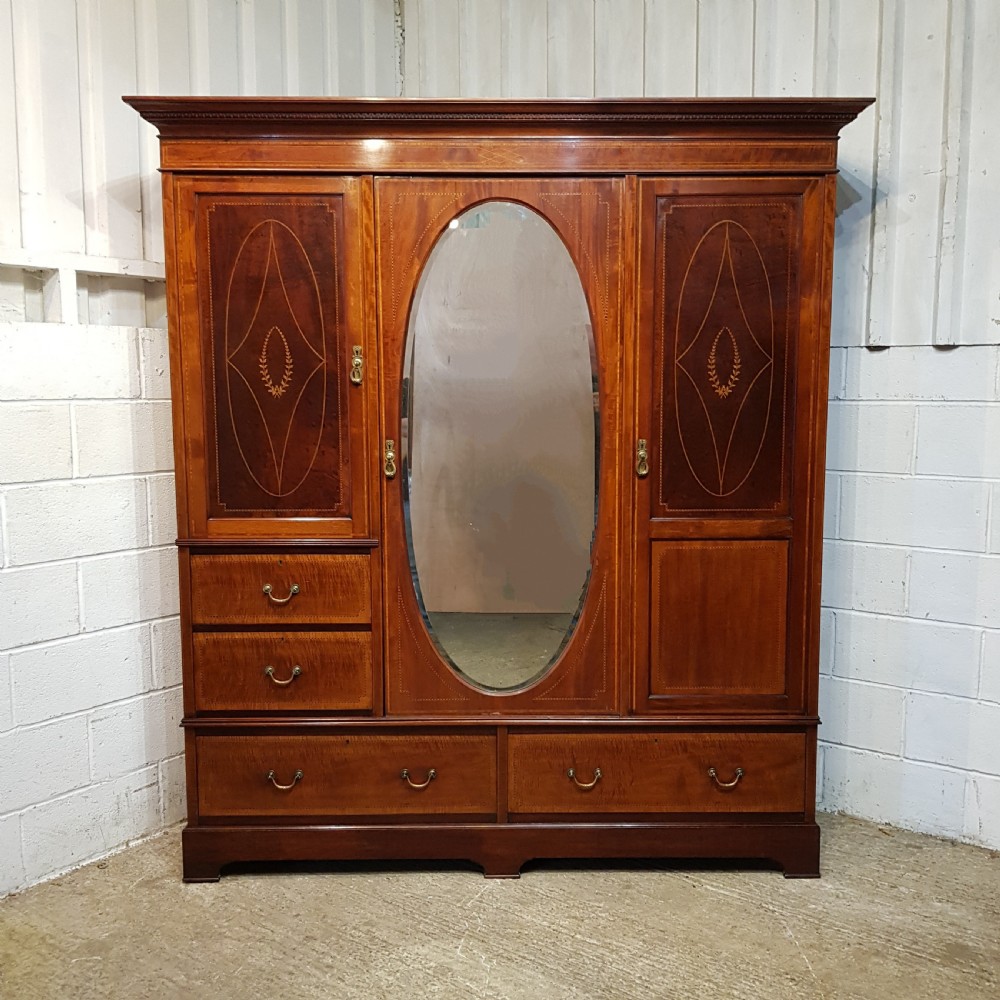 AN EDWARDIAN MAHOGANY TRIPLE WARDROBE C1900. View III