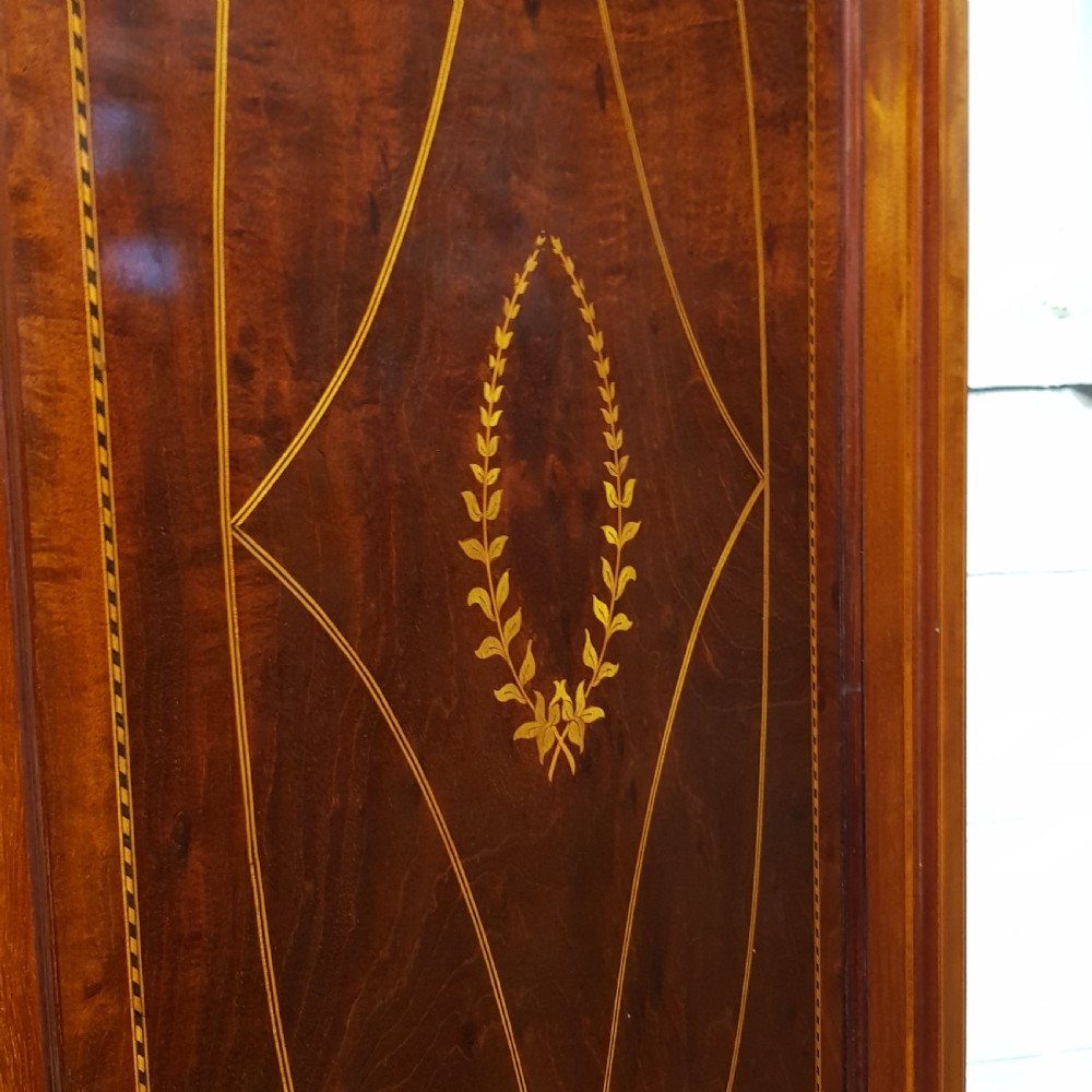 AN EDWARDIAN MAHOGANY TRIPLE WARDROBE C1900. View V
