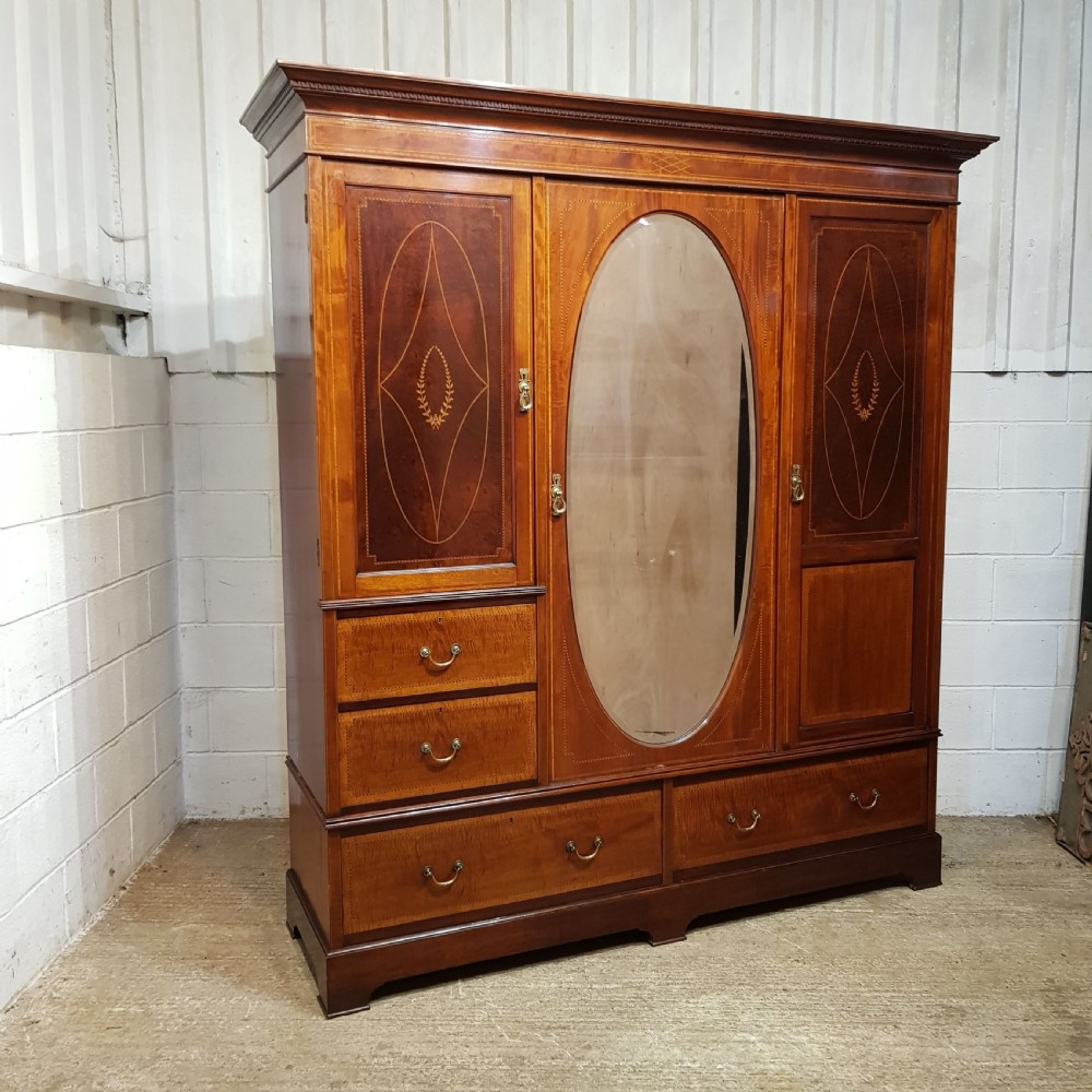 AN EDWARDIAN MAHOGANY TRIPLE WARDROBE C1900. View VI