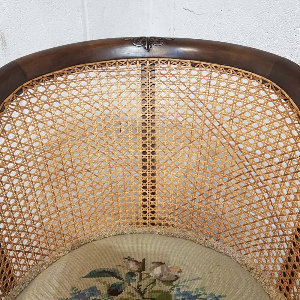 A DENBY & SPINKS MAHOGANY FRAMED BERGERE BACKED TUB CHAIR C1920 View VIII