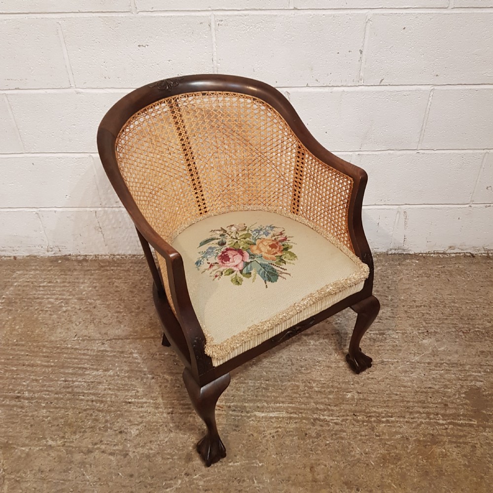 A DENBY & SPINKS MAHOGANY FRAMED BERGERE BACKED TUB CHAIR C1920 View X