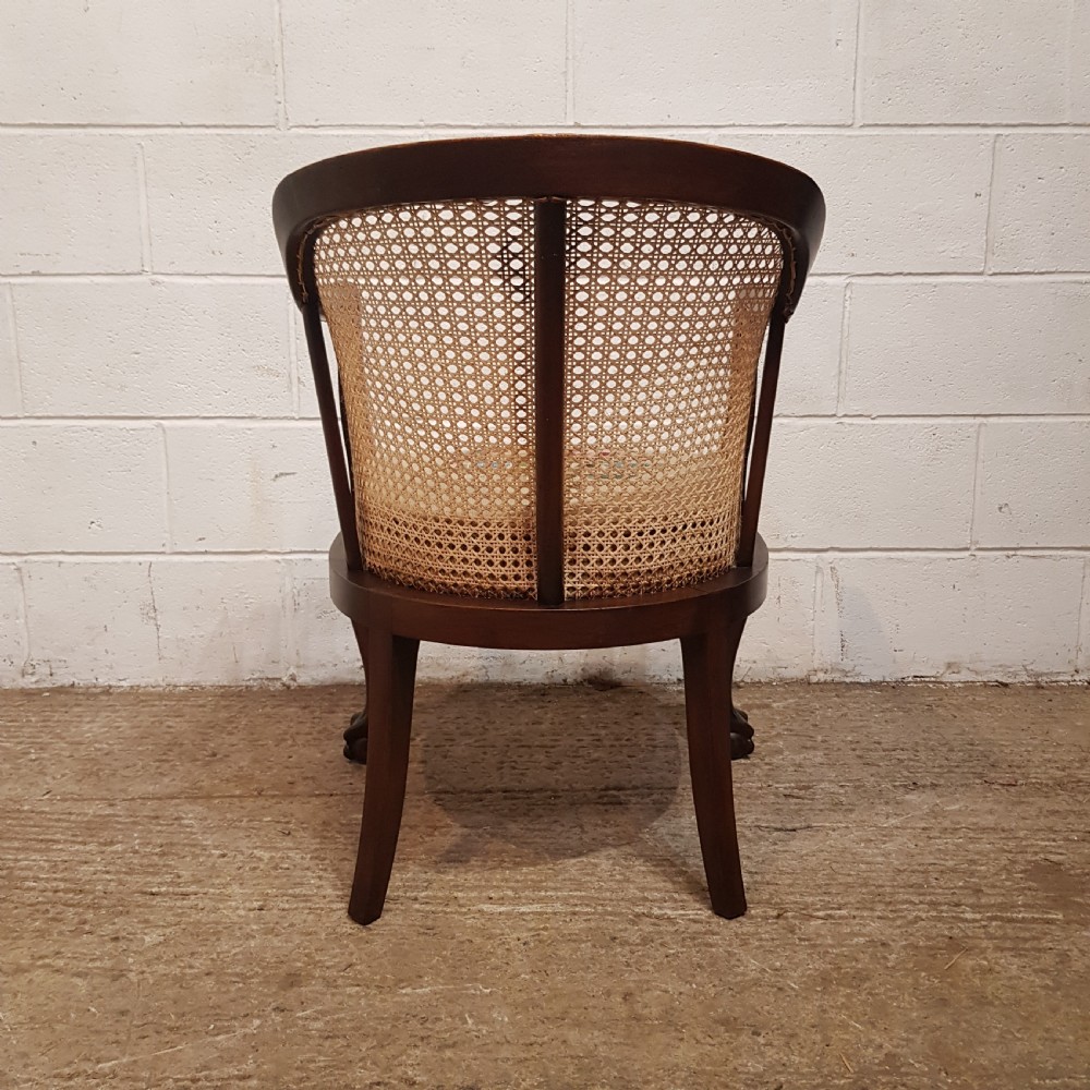 A DENBY & SPINKS MAHOGANY FRAMED BERGERE BACKED TUB CHAIR C1920 View XI