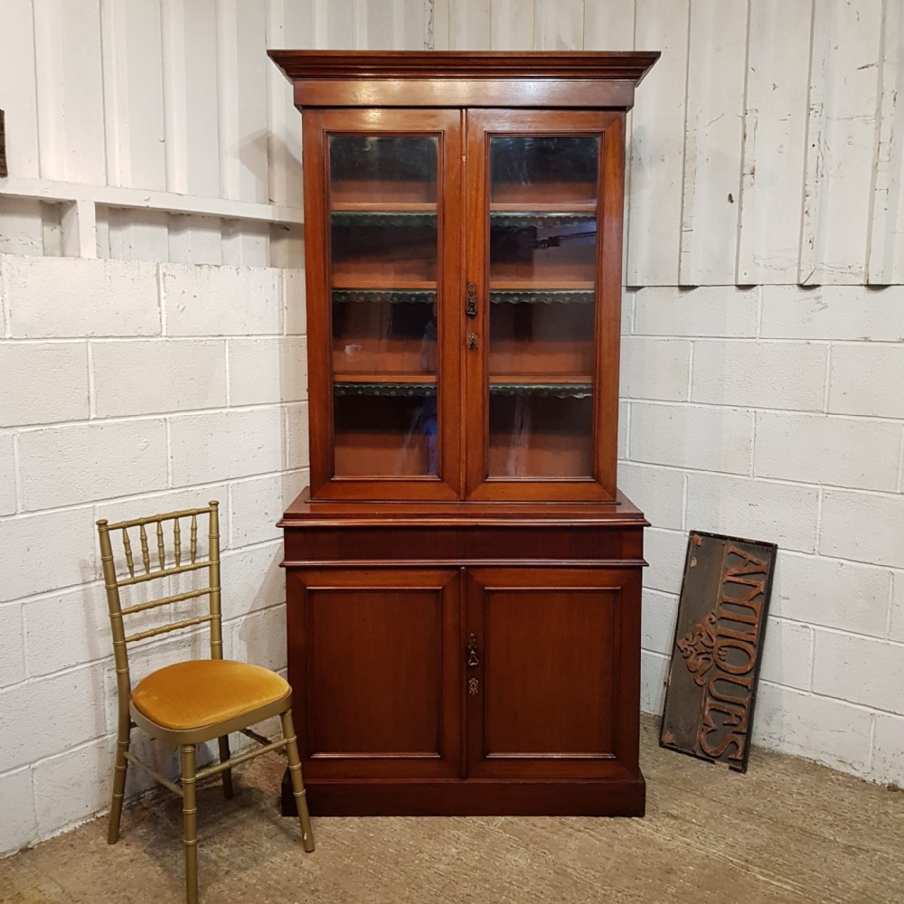 A VICTORIAN MAHOGANY BOOKCASE ON CUPBOARD C1880