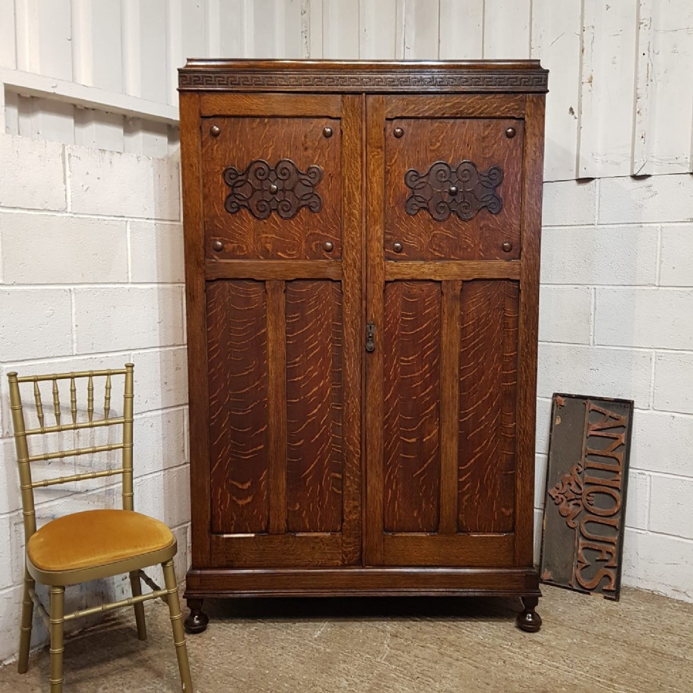 AN ANTIQUE OAK DOUBLE WARDROBE C1920