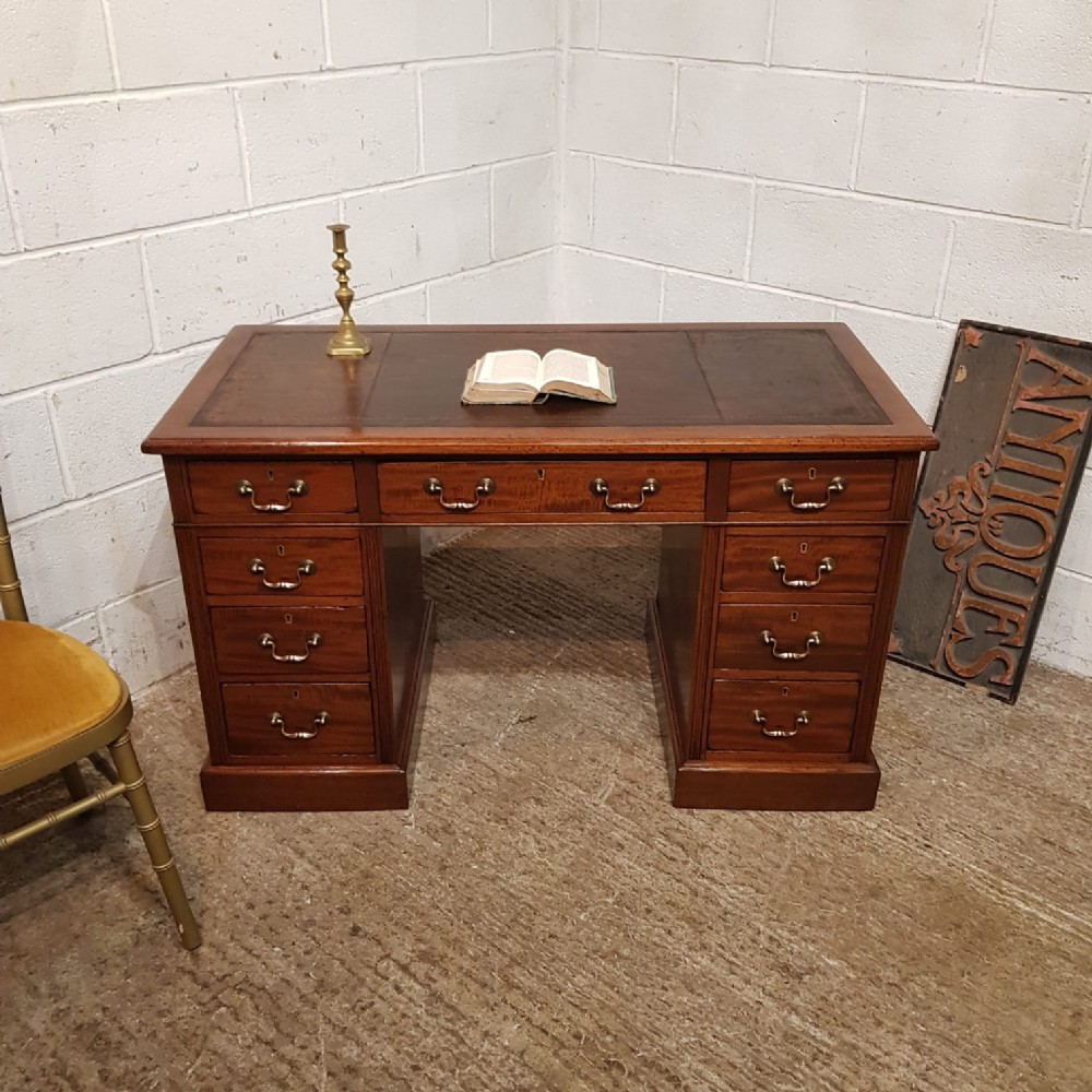 A LATE VICTORIAN MAHOGANY TWIN PEDESTAL DESK C1890