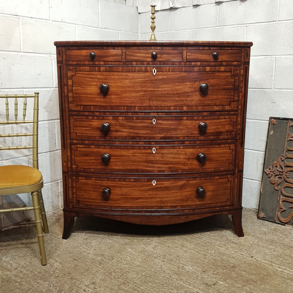 A VICTORIAN BOW FRONTED MAHOGANY WITH EBONY STRING SECRETAIRE CHEST OF DRAWERS C1850