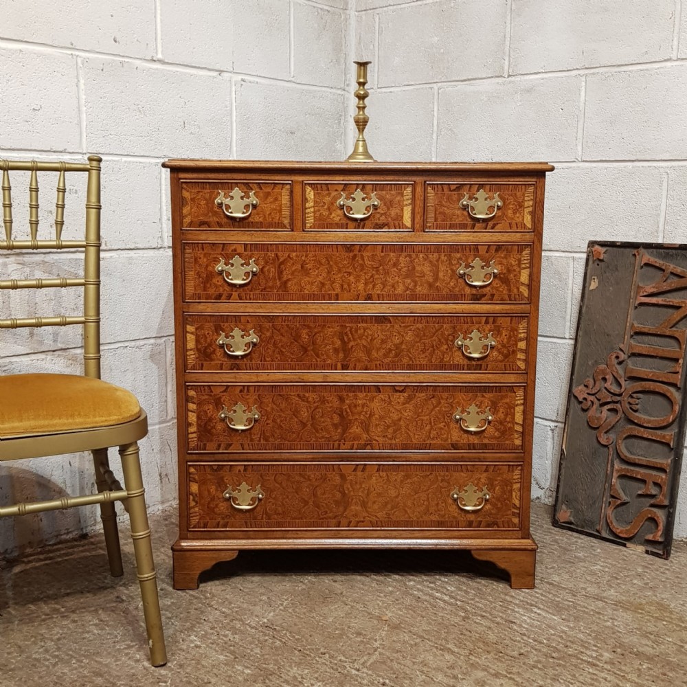 A BURR WALNUT AND OAK CHEST OF DRAWERS C1920