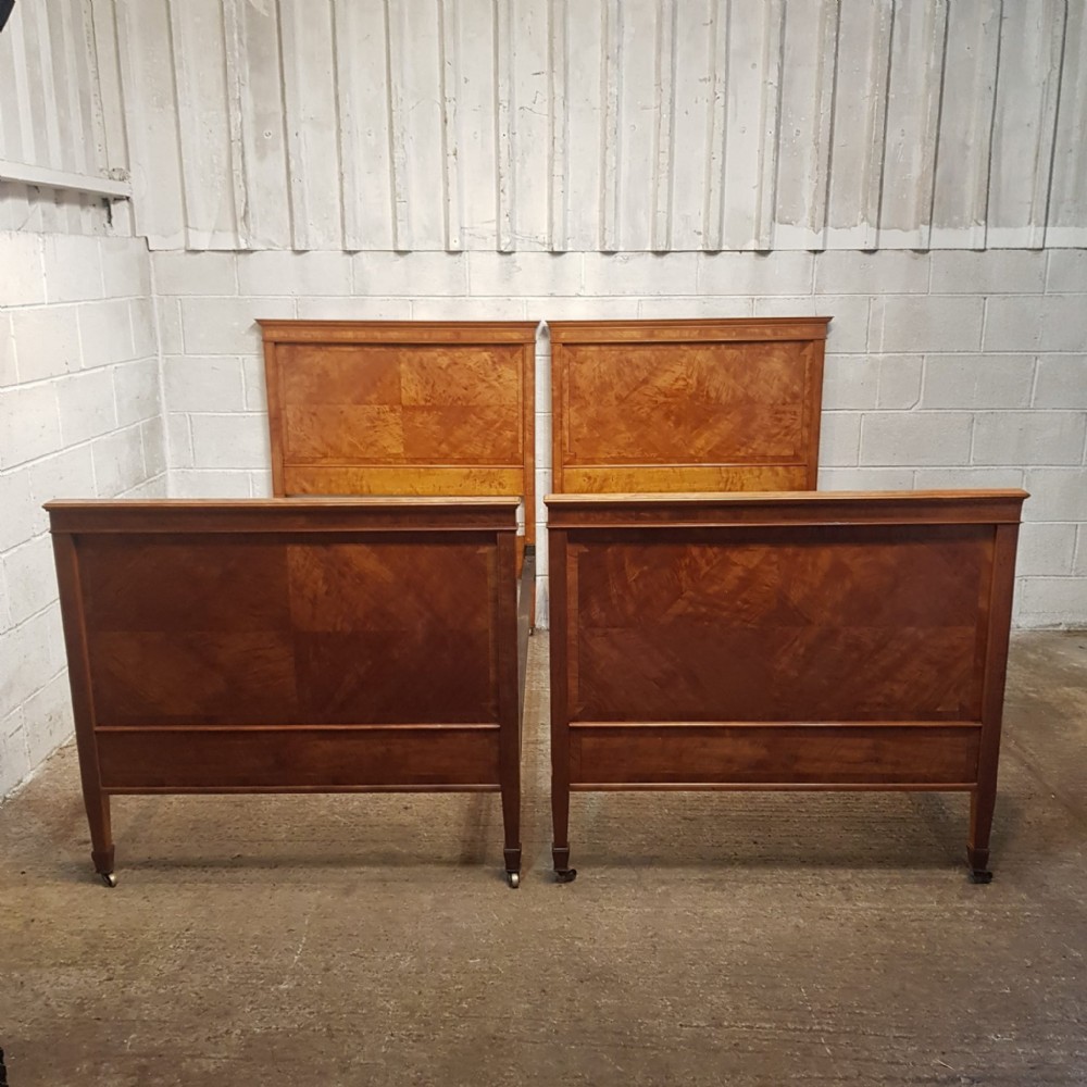 A PAIR OF SATINWOOD SHAPLAND AND PETTER SINGLE BEDS C1890