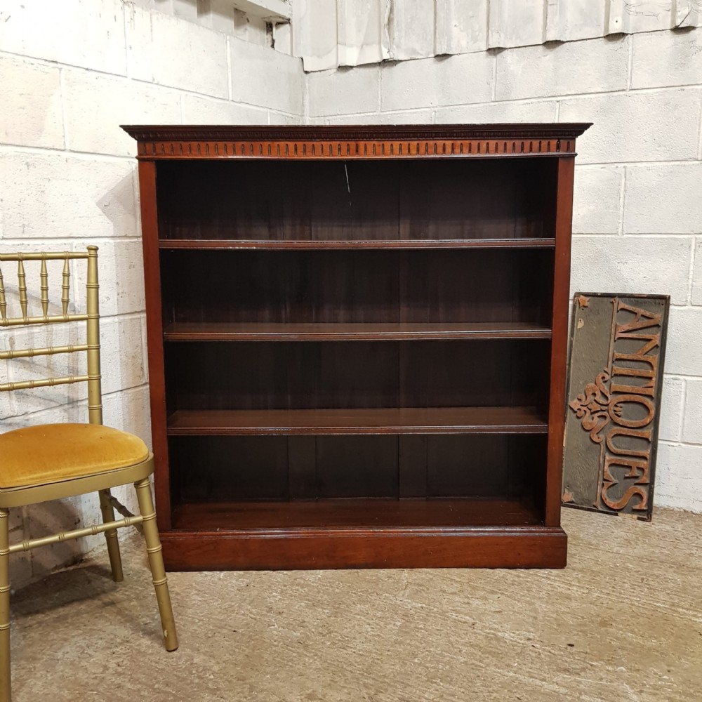 A VICTORIAN WALNUT OPEN BOOKCASE C1880