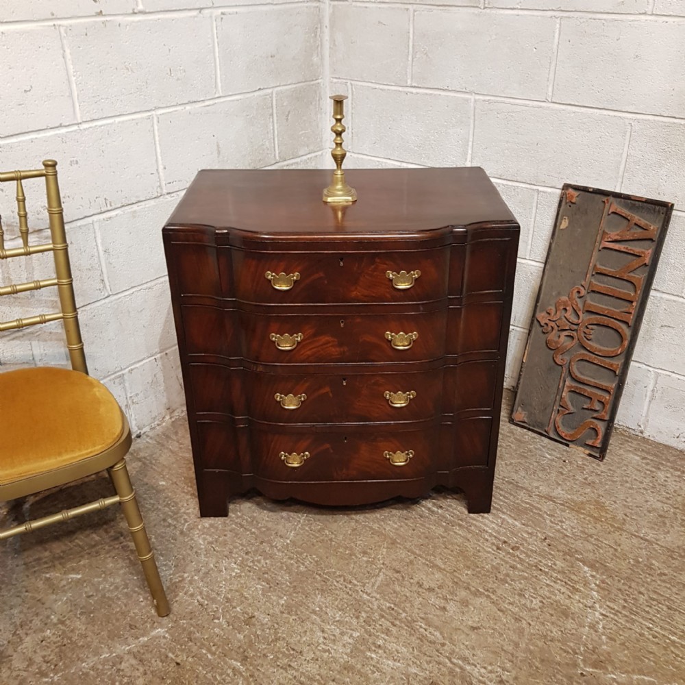 A MAHOGANY SERPENTINE FRONTED DRESSING CHEST WITH MIRROR C1920