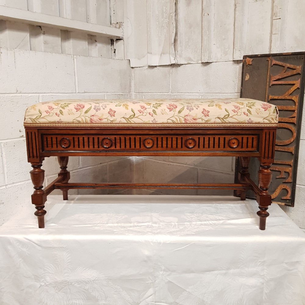 AN OAK AND EBONY DUET PIANO STOOL C1810