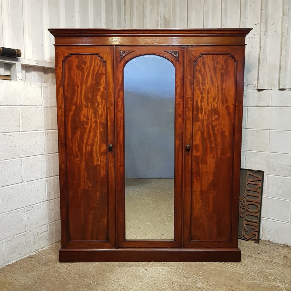 A VICTORIAN MAHOGANY TRIPLE WARDROBE C1870