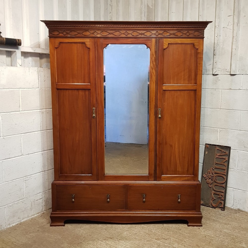 A SMALL EDWARDIAN MAHOGANY TRIPLE WARDROBE C1900