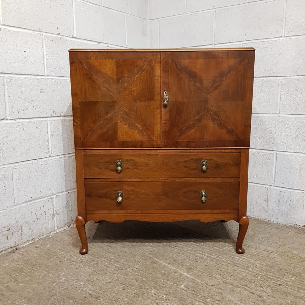 A BURR WALNUT TALLBOY C1920
