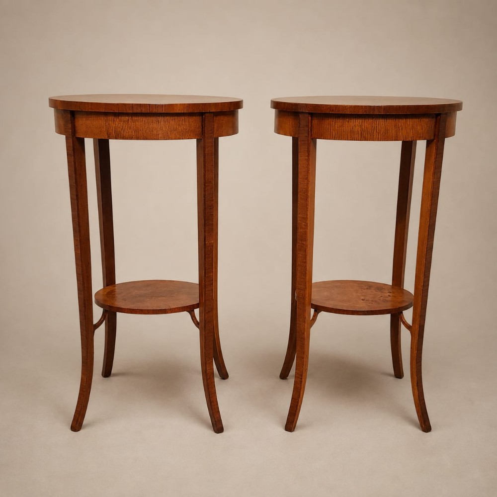 A PAIR OF OVAL WALNUT SIDE / LAMP TABLES C1920