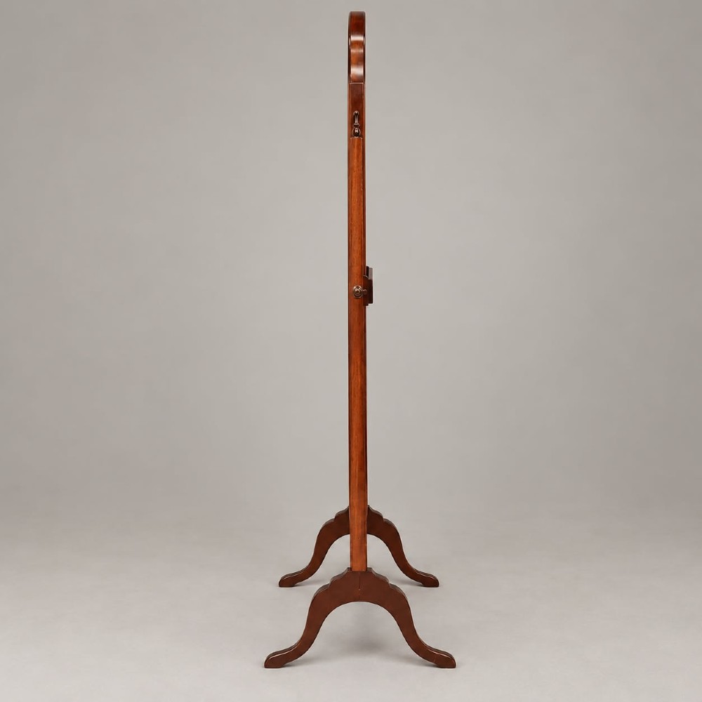 A 1920s full-length mahogany cheval mirror featuring an arched top frame, upright side posts with finials, turned cross-stretcher, and splayed feet. View IV