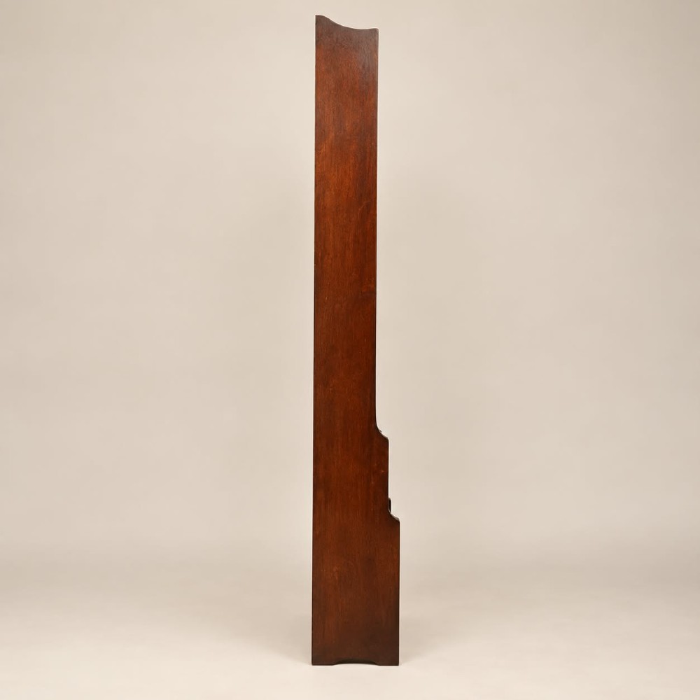 A tall and narrow dark oak waterfall bookcase circa 1920 with six open shelves graduating in depth. View IV